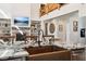 Open concept kitchen with copper sink, island, and view into living room at 3505 Moss Landing Rd, Acworth, GA 30102