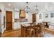 Spacious kitchen with wooden island, stainless steel appliances, and brick backsplash at 3505 Moss Landing Rd, Acworth, GA 30102