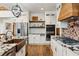 Bright kitchen with copper farm sink, granite countertops, and high-end appliances at 3505 Moss Landing Rd, Acworth, GA 30102