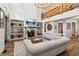 Spacious living room with fireplace, built-in shelving, and hardwood floors at 3505 Moss Landing Rd, Acworth, GA 30102