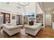 Spacious living room with fireplace, built-in shelving, and hardwood floors at 3505 Moss Landing Rd, Acworth, GA 30102