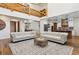 Two-story living room with hardwood floors and views of kitchen at 3505 Moss Landing Rd, Acworth, GA 30102