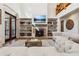 Spacious living room with fireplace, built-in shelving, and hardwood floors at 3505 Moss Landing Rd, Acworth, GA 30102