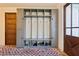 Inviting mudroom features built-in storage and brick flooring at 3505 Moss Landing Rd, Acworth, GA 30102