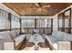 Relaxing screened porch with wicker furniture and wood ceiling at 3505 Moss Landing Rd, Acworth, GA 30102