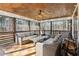 Relaxing screened porch with wicker furniture and wood ceiling at 3505 Moss Landing Rd, Acworth, GA 30102