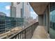 Balcony view overlooking city with glass buildings, sky, and metal railing at 1080 Peachtree Ne St # 804, Atlanta, GA 30309