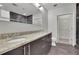 Modern bathroom features double sinks, granite countertops, dark cabinets, and a large walk-in closet at 1080 Peachtree Ne St # 804, Atlanta, GA 30309