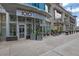 Exterior view of building entrance with planters and nearby restaurants at 1080 Peachtree Ne St # 804, Atlanta, GA 30309