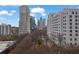 Great city view with tree lined streets and various buildings in the distance at 1080 Peachtree Ne St # 804, Atlanta, GA 30309