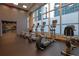 Community gym with elliptical machines and large windows at 1080 Peachtree Ne St # 804, Atlanta, GA 30309