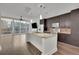 Modern kitchen features an island with marble countertops, stainless steel appliances, and an open floor plan at 1080 Peachtree Ne St # 804, Atlanta, GA 30309