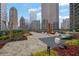 Relaxing outdoor lounge area with garden, seating, and stunning city views at 1080 Peachtree Ne St # 804, Atlanta, GA 30309