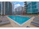 Beautiful outdoor pool with lounge chairs surrounded by high-rise condo buildings at 1080 Peachtree Ne St # 804, Atlanta, GA 30309