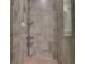 Modern shower features tiled walls, tiled floor, and mounted caddy at 1080 Peachtree Ne St # 804, Atlanta, GA 30309