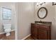 Well-appointed bathroom with granite vanity and a large mirror at 2035 Walnut Creek Xing, Alpharetta, GA 30005