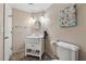 Bathroom with white vanity, brushed nickel hardware, and floral artwork at 2035 Walnut Creek Xing, Alpharetta, GA 30005