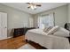 Comfortable bedroom with hardwood floors, ceiling fan, and neutral decor at 2035 Walnut Creek Xing, Alpharetta, GA 30005