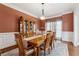 Formal dining room with hardwood floors, and a wooden dining set at 2035 Walnut Creek Xing, Alpharetta, GA 30005