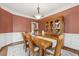 Formal dining room with hardwood floors, and a wooden dining set at 2035 Walnut Creek Xing, Alpharetta, GA 30005