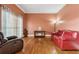 Living room with hardwood floors, fireplace, and large windows at 2035 Walnut Creek Xing, Alpharetta, GA 30005