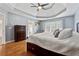 Main bedroom with hardwood floors and tray ceiling at 2035 Walnut Creek Xing, Alpharetta, GA 30005