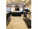 Spacious recreation room complete with gym equipment and tv at 2035 Walnut Creek Xing, Alpharetta, GA 30005