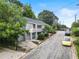 Gray house on a tree-lined street with a yellow car at 261 Fletcher Sw St, Atlanta, GA 30315