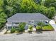 Stunning aerial view of a large two-story home with mature trees and a well-maintained yard at 261 Fletcher Sw St, Atlanta, GA 30315