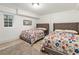 Basement bedroom with two twin beds featuring floral bedding at 261 Fletcher Sw St, Atlanta, GA 30315