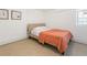 Cozy basement bedroom with a double bed and coral coverlet at 261 Fletcher Sw St, Atlanta, GA 30315