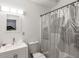 Clean and modern bathroom featuring a sleek vanity, toilet, and stylish shower curtain at 261 Fletcher Sw St, Atlanta, GA 30315