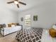 Bright bedroom with two beds, neutral decor, and a sunny window at 261 Fletcher Sw St, Atlanta, GA 30315