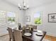 Bright dining room with wood table, chairs, and artwork at 261 Fletcher Sw St, Atlanta, GA 30315