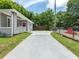 Newly paved driveway and landscaping with gray house at 261 Fletcher Sw St, Atlanta, GA 30315