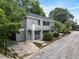 Gray two-story house with a balcony and driveway at 261 Fletcher Sw St, Atlanta, GA 30315