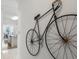 Hallway featuring unique bicycle decor, leading to a bright and open kitchen and dining area at 261 Fletcher Sw St, Atlanta, GA 30315