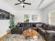 Living room with sectional sofa, coffee table, and smart TV at 261 Fletcher Sw St, Atlanta, GA 30315