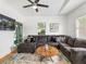 Inviting living room features a comfortable gray sofa, a patterned rug, and modern decor at 261 Fletcher Sw St, Atlanta, GA 30315