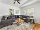 Spacious living room featuring a large sectional sofa, coffee table, and area rug at 261 Fletcher Sw St, Atlanta, GA 30315