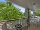 Enjoy outdoor dining on this covered porch with mature trees offering shade at 261 Fletcher Sw St, Atlanta, GA 30315