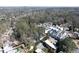 An aerial view shows the neighborhood with a tree canopy and proximity to Atlanta's skyline at 4086 Haverhill Dr, Atlanta, GA 30342