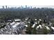 The aerial view showcases a neighborhood with the Atlanta skyline in the background at 4086 Haverhill Dr, Atlanta, GA 30342