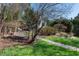 Lush backyard garden path leading to gazebo with mature trees and plantings at 4086 Haverhill Dr, Atlanta, GA 30342