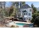 A backyard with a pool, deck, patio area and a built in swing providing a private outdoor space at 4086 Haverhill Dr, Atlanta, GA 30342