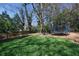 Large grassy backyard with mature trees, perfect for outdoor activities and play at 4086 Haverhill Dr, Atlanta, GA 30342