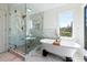 Relaxing bathroom featuring a soaking tub and glass enclosed shower at 4086 Haverhill Dr, Atlanta, GA 30342