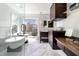 Bright bathroom features a soaking tub, marble floors, glass shower, and vanity at 4086 Haverhill Dr, Atlanta, GA 30342