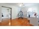 Cozy room with hardwood floors, a modern desk, and a unique hanging chair; part of a bedroom set at 4086 Haverhill Dr, Atlanta, GA 30342