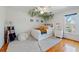 Bright bedroom features a decorative ceiling fan, plush rug, and ample natural light from a large window at 4086 Haverhill Dr, Atlanta, GA 30342